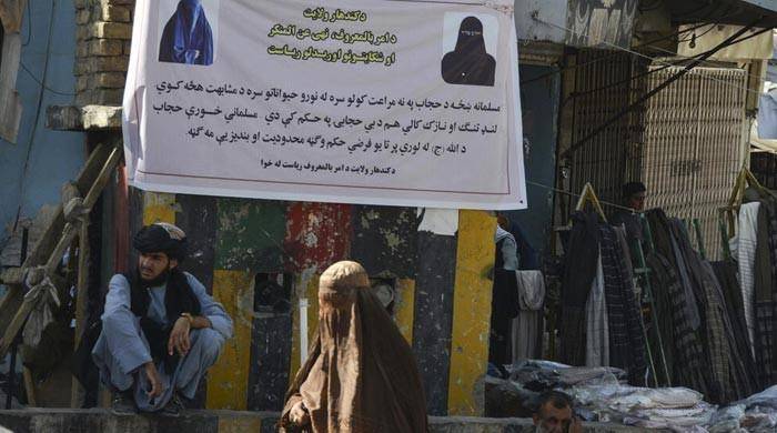 Taliban Display Posters Saying Women Without Hijab 'Try To Look Like Animals'