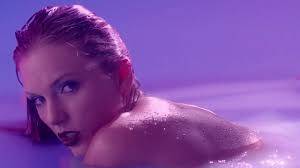 Surrealist Video Sees Taylor Swift Strip In A Purple Pool