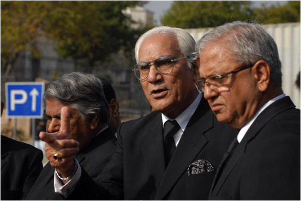 Ahmed Raza Kasuri, a lawyer representing Pervez Musharraf, speaks to reporters outside the special court formed to try the former military dictator