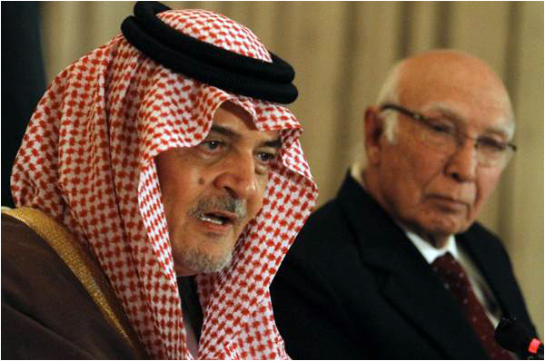 Saudi Foreign Minister Prince Saud al-Faisal speaks as Sartaj Aziz, Pakistan's special adviser on national security and foreign affairs, looks on during a press conference in Islamabad on January 7