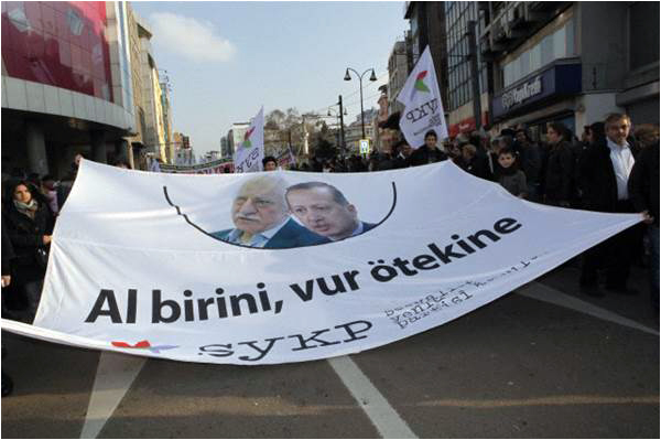 A banner at a rally against corruption in December features pictures of Gulen and Erdogan, and reads 'one is no better than the other'