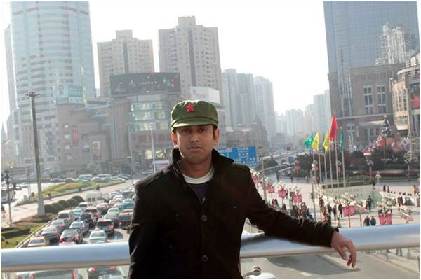 The author in downtown Shanghai wearing a Mao cap