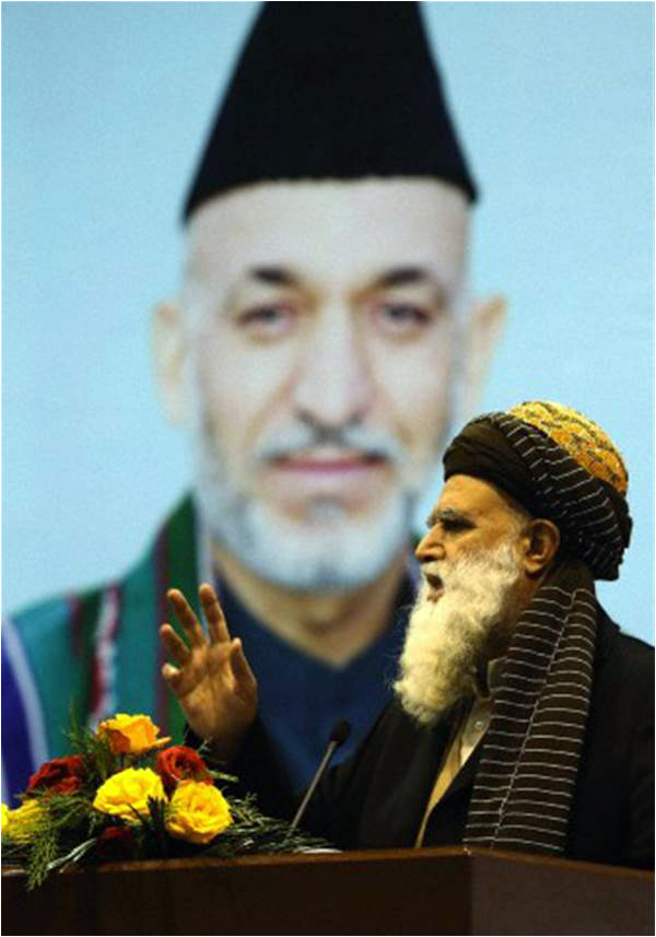 Afghan presidential candidate and former warlord Abdul Rab Rasoul Sayyaf speaks during a campaign rally in Kabul