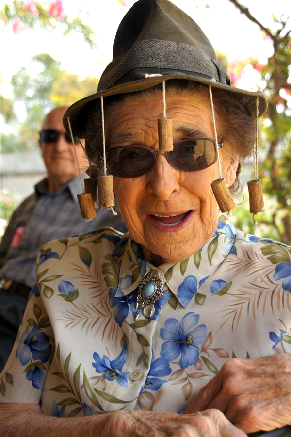 An Australian woman wears a unique Australian hat used to ward off flies