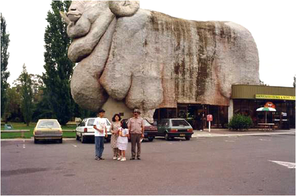 The author and his family pose in front of a gigantic Merino sheep statue in Golburn