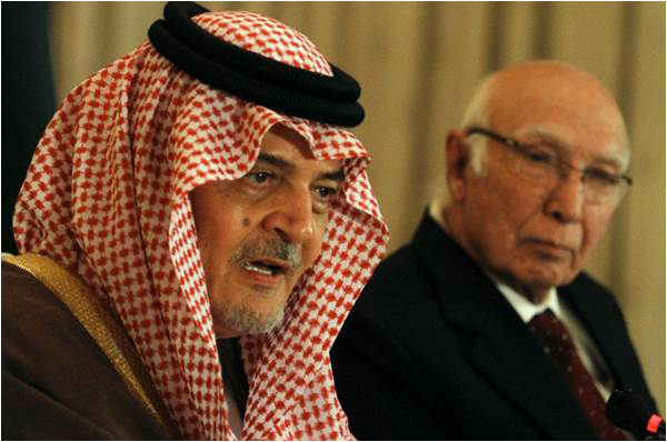 Saudi Foreign Minister Prince Saud al-Faisal, left, speaks as Sartaj Aziz, Pakistan's special adviser on national security and foreign affairs, looks on during a press conference in Islamabad