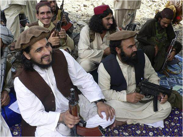 Hakimullah and Walur Rehman sit together at a Taliban meeting
