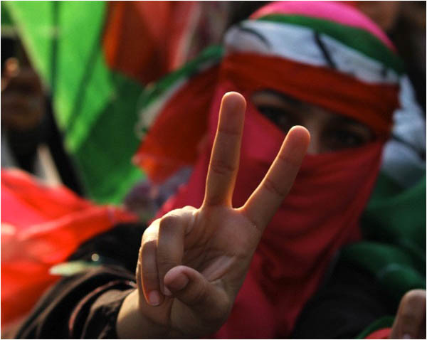 A supporter of Tahirul Qadri's Pakistan Awami Tehrik at a rally in Lahore on May 11
