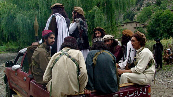 Taliban men patrol in Waziristan in these 2012 photographs