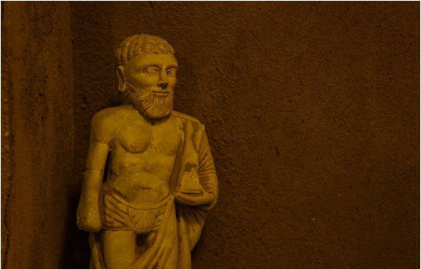 A Herculean statue in the basement