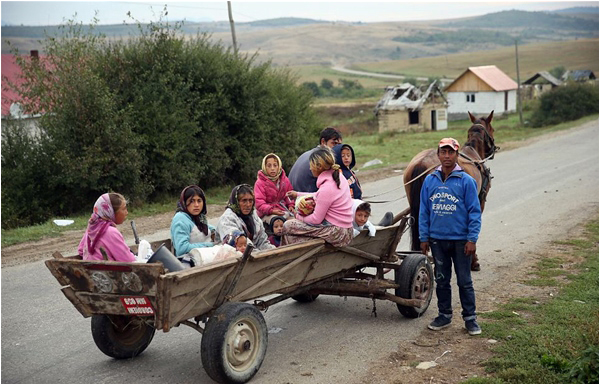 A family of Romas on a horse cart