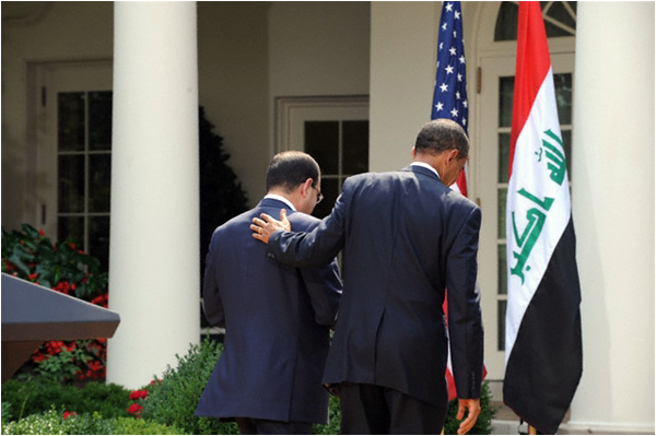 Barack Obama and Nuri al Maliki walk out of the Rose Garden of the White House