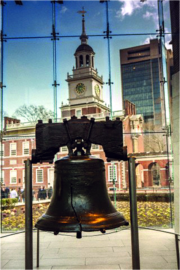 The Liberty Bell, with the Independence Hall in the background, in Philadelphia