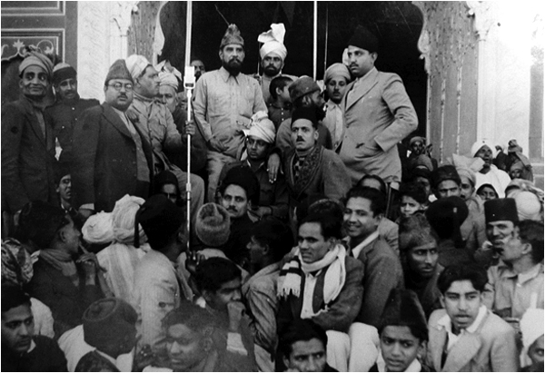 Allama Mashriqui at Badshahi Mosque. Mir Ali Ahmed on the right with hand in coat pocket. 8-1-1943