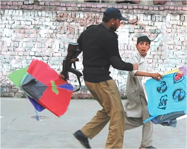Policeman Apprehending A Young Boy for teh Crime of Flying Kites