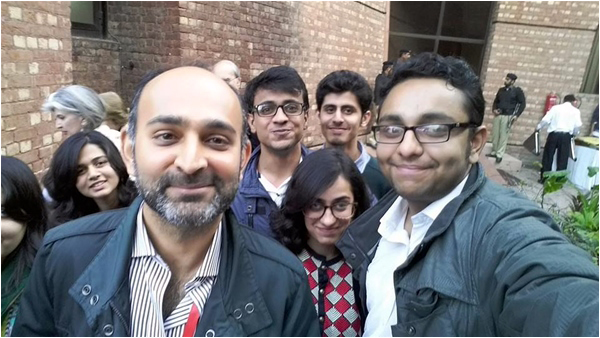 Young fans take a selfie with Mohsin Hamid