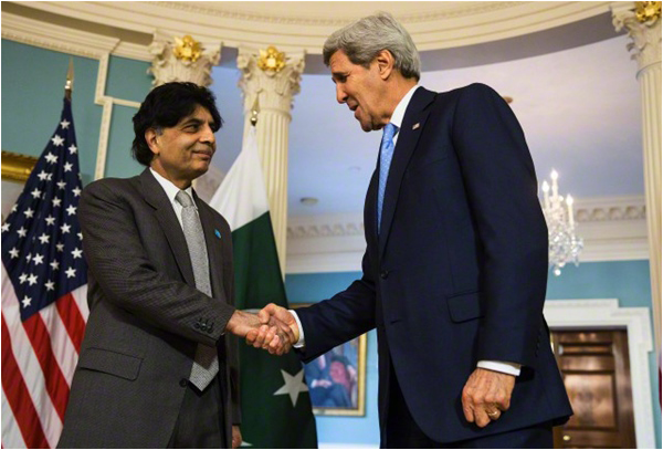 US Secretary of State John Kerry shakes hands with Interior Minister Chaudhry Nisar on the sidelines of the White House Summit on Countering Violent Extremism
