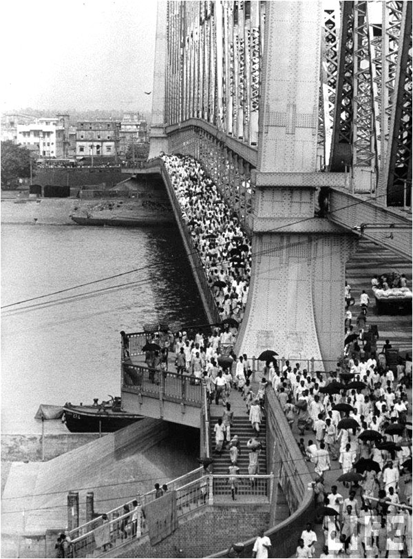 People cross the Hooghly over the Howrah Bridge (in then Calcutta), built in 1942