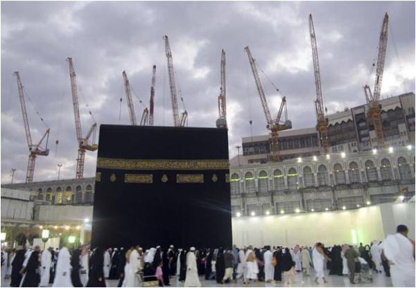 After – Construction cranes visible as pilgrims circle the Kaaba at the Grand Mosque - Photo credit Reuters