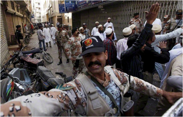 Paramilitary soldiers and residents gather outside a Bohra mosque after an explosion - March 20, 2015