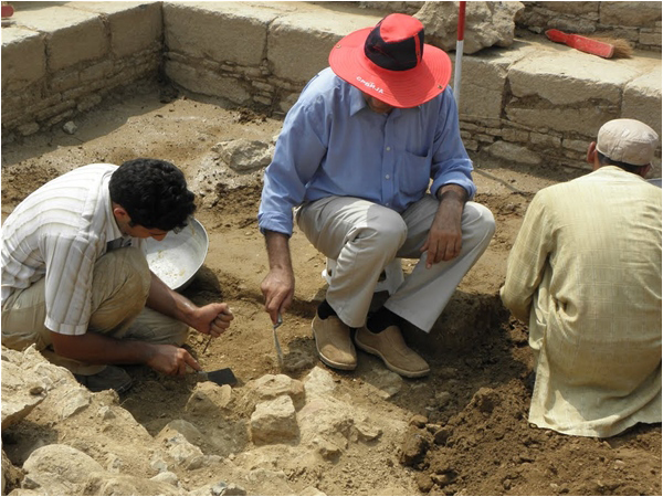 Archaeologists painstakingly at work at a dig site in Taxila