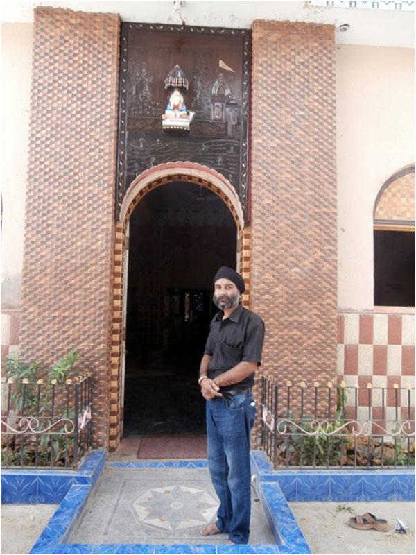 Suresh Kumar Lohana standing near the entrance