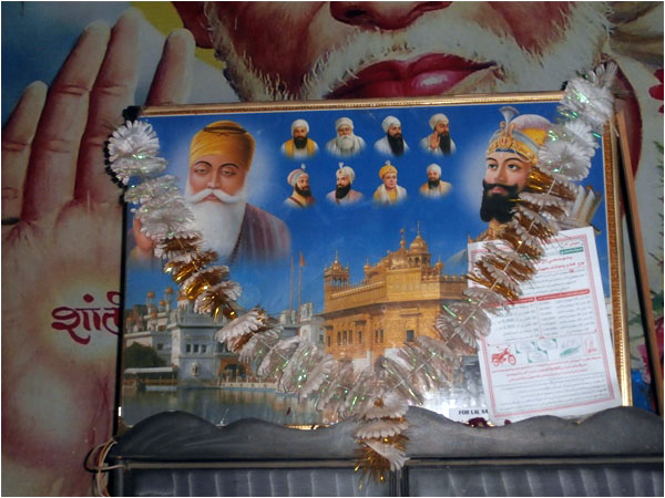 The poster showing images of Baba Guru Nanak and other gurus