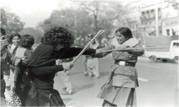 A woman gets baton-charged at a PSF rally in 1981