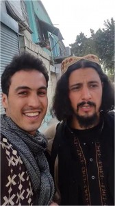A civilian in Kunduz takes a selfie with a Taliban fighter