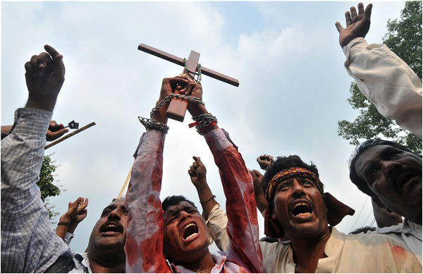 Christian men protest after a terrorist attack on two churches in Lahore in March