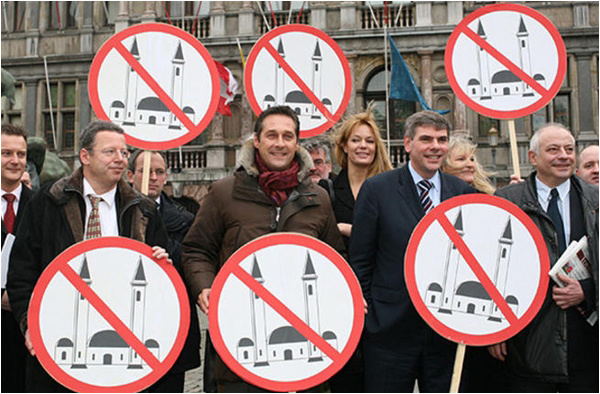 Members of several European right-wing parties pose with signs in Antwerp - AFP