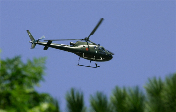 A military helicopter flies over Lal Masjid in July 2007