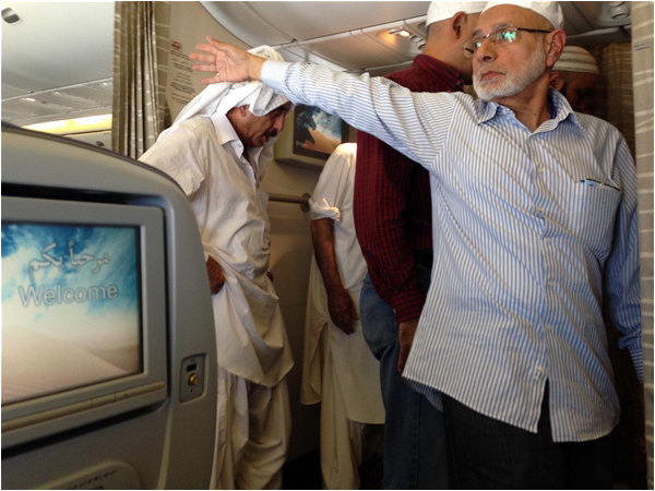 Pakistani pilgrims on the return flight from Hajj
