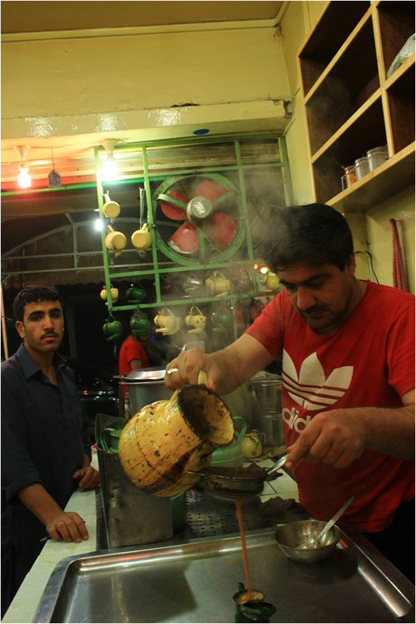 Rehmat Ullah serves tea