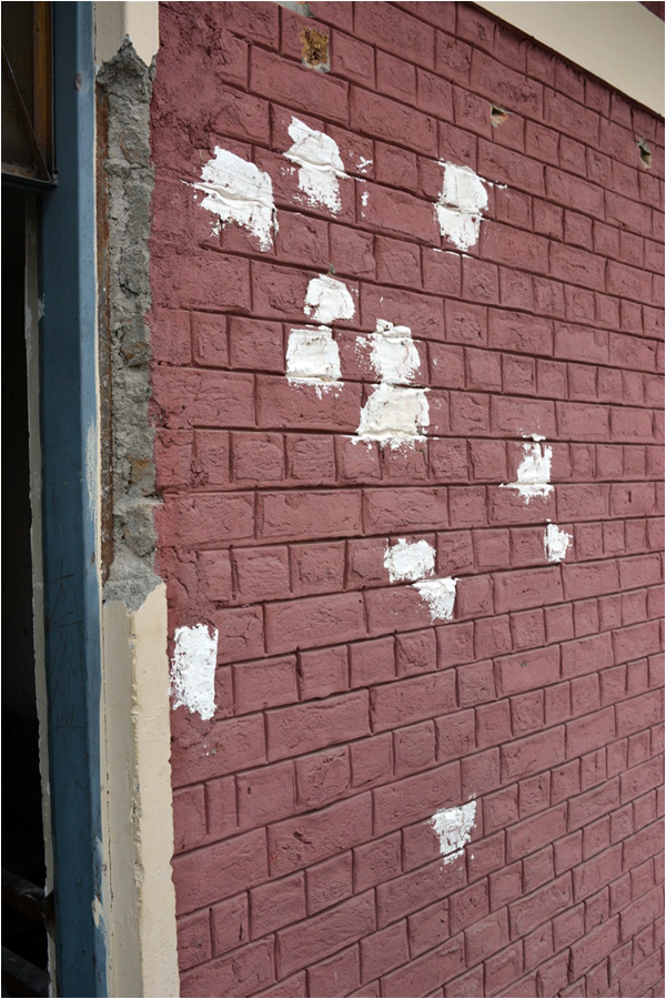 White paint - used to hastily cover up bullet-marks on campus - Photos: Luavut Zahid