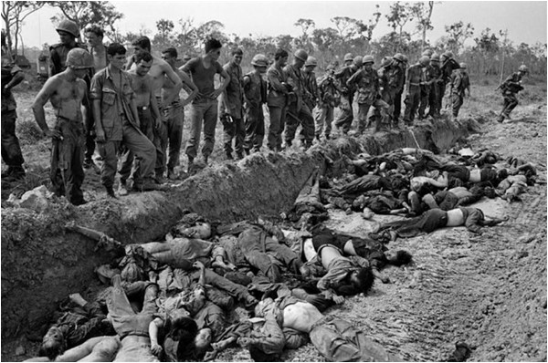 US soldiers in Vietnam prepare a mass grave for Vietcong insurgents in 1967