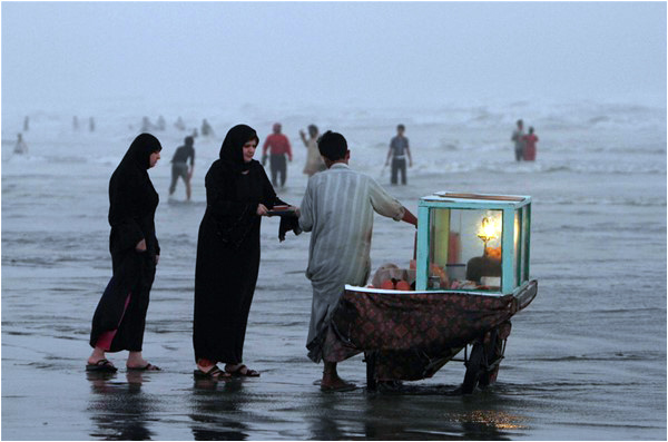 Public spaces, including beaches, can be difficult for women to navigate without 'modest' clothing - Photo courtesy - AP, Shakil Adil 