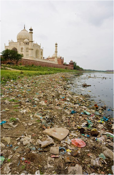 Heaps of trash towards the rear of the Taj Mahal are not easily reconciled with the romantic image of the monument