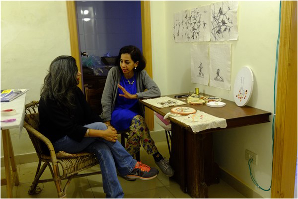 Sameera Raja, gallerist, during a studio visit with Sarah Mumtaz