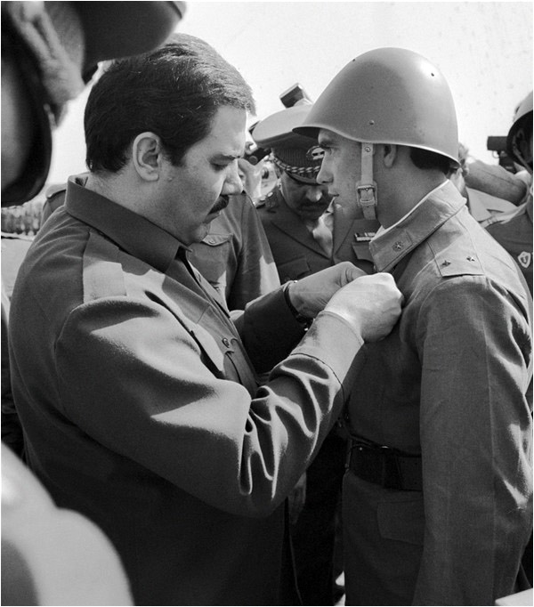 Najibullah issues a decoration to a Soviet soldier
