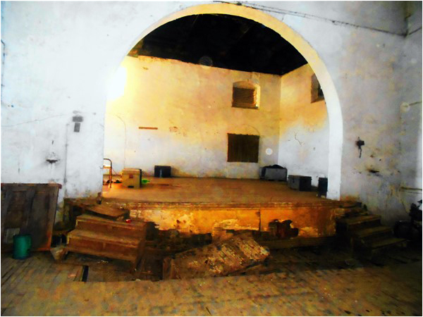 The stage of the Nautch Ghar, once filled with dancers, is now rotting